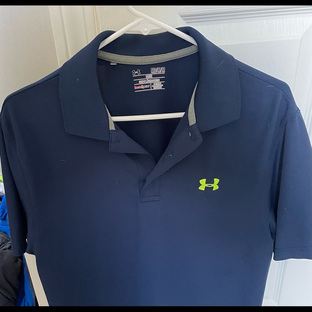 Blue under armor polo in good condition, no stains or tears